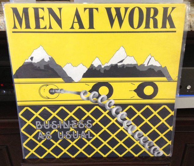 men at work buiness as usual.jpg