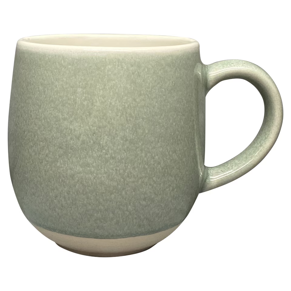 A plain light green ceramic mug