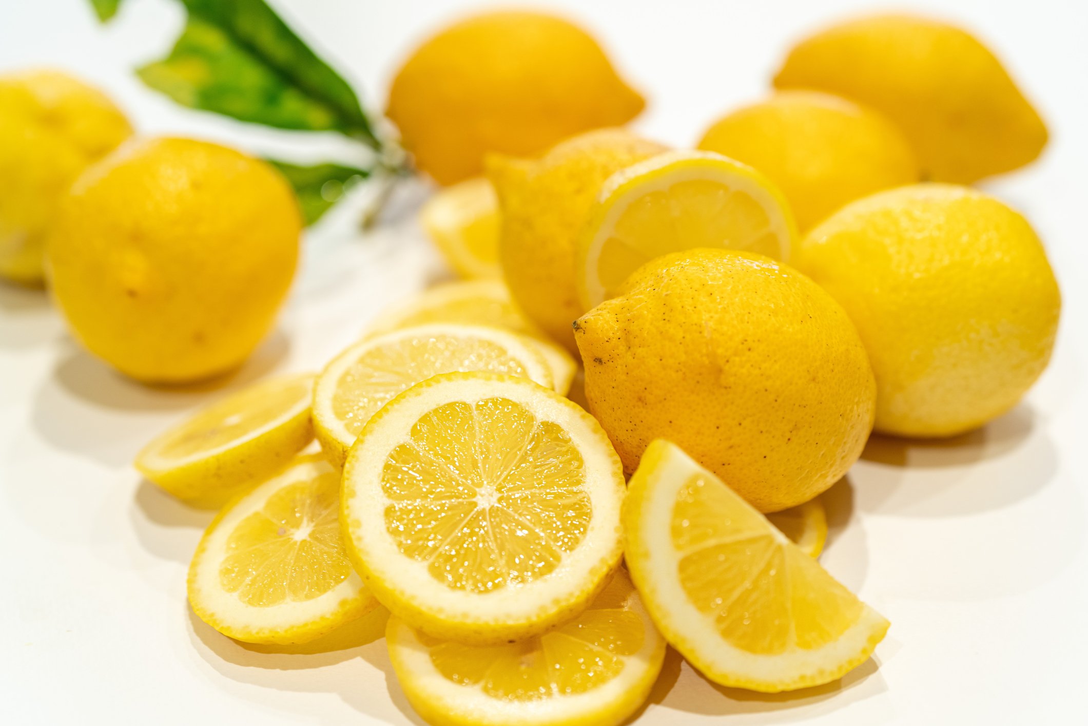 cut lemons on a white background