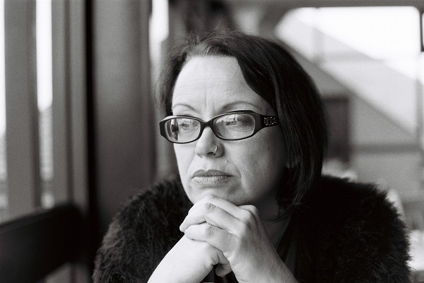 black and white image of woman in glasses