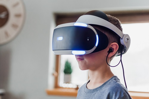 Young boy wearing virtual reality glasses