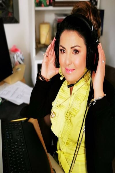 image of a young woman wearing a gaming headset, Maria