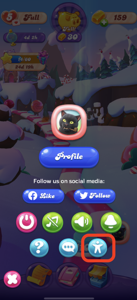 In-game screen from 'Candy Crush Friends Saga' showing 'Profile' button and various game icons, including a highlighted 'Accessibility' icon encased in a red square at the bottom