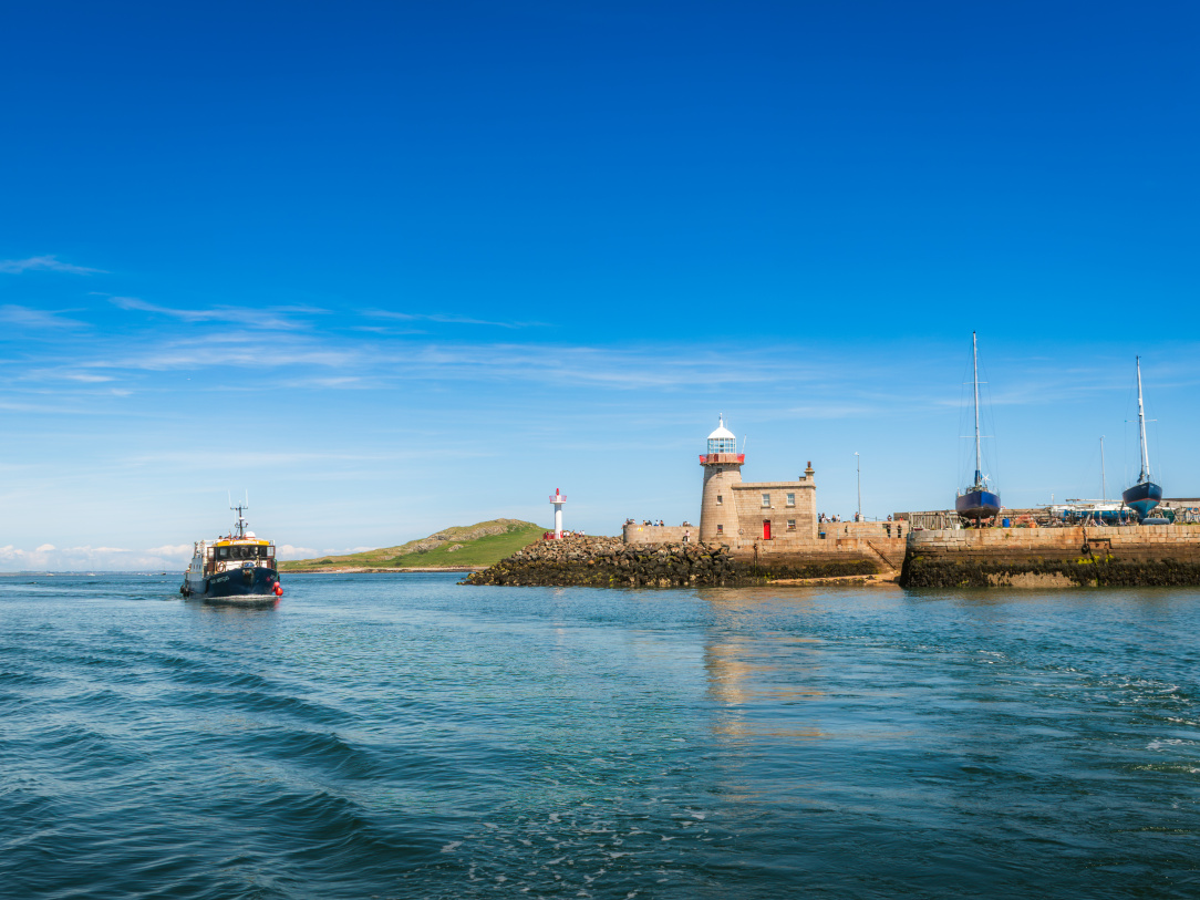2026-06-21 Howth Lighthouse and Harbour from Ireland's Eye cruise with blue skies.jpg