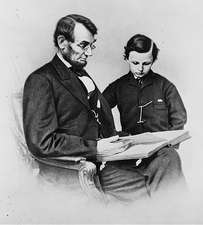 abraham lincoln reading to a boy