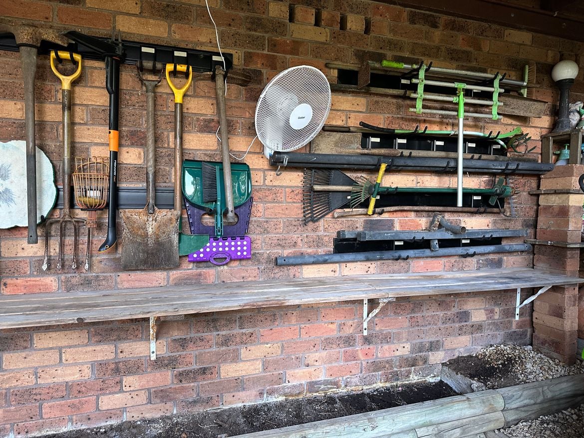 Garden tool bracket storage rack on brick wall - Bunnings Workshop ...