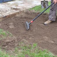 3. Use a mattock or hoe to remove excess soil.jpg 3. Use a mattock or hoe to remove excess soil.jpg