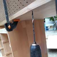 8.9 Drilling attachment holes from beneath bench into pegboard..png 8.9 Drilling attachment holes from beneath bench into pegboard..png