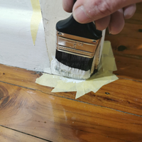 5.3 Cutting in around architrave with undercoat.png 5.3 Cutting in around architrave with undercoat.png