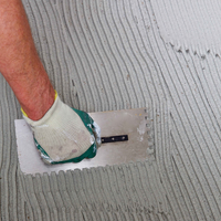 Step 4 Use notched trowel to spread cement base.png Step 4 Use notched trowel to spread cement base.png