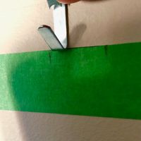 3.5 Place hook on aove the middle mark on the tape.jpg 3.5 Place hook on aove the middle mark on the tape.jpg