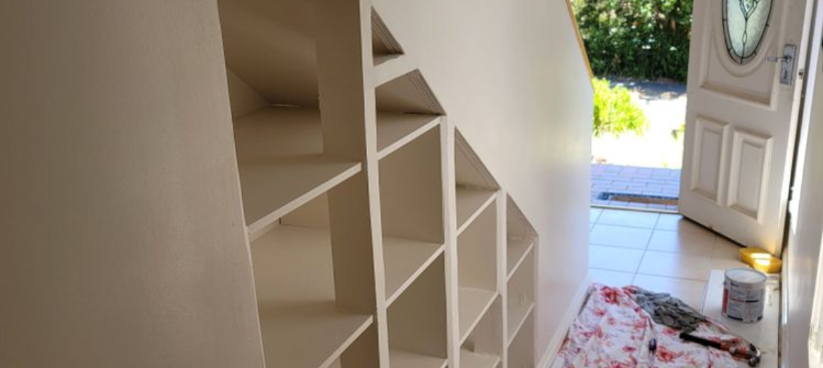 Shoe shelves built into staircase.png Shoe shelves built into staircase.png