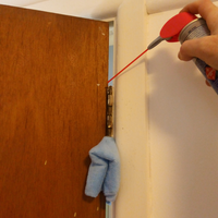 Step 1.3 Lubricating hinge on other side.png Step 1.3 Lubricating hinge on other side.png