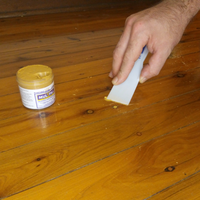 3.4 Applying putty to screw hole.png 3.4 Applying putty to screw hole.png