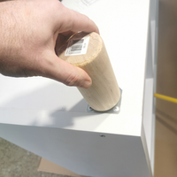 2.6 Screwing leg onto plate.png 2.6 Screwing leg onto plate.png