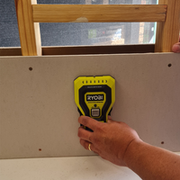 Step 3.1 Place stud finder on wall to calibrate.png Step 3.1 Place stud finder on wall to calibrate.png