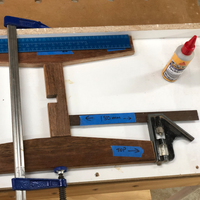 6.2 Crossover glued and clamped between legs.png 6.2 Crossover glued and clamped between legs.png