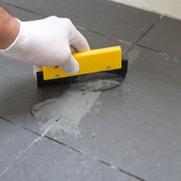 Step 6 Use squeegee to work grout into gaps.png Step 6 Use squeegee to work grout into gaps.png