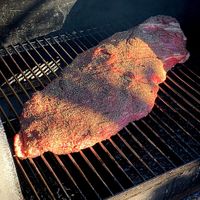 Step 4 - Place brisket in smoker.jpg Step 4 - Place brisket in smoker.jpg