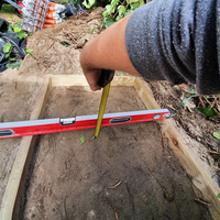 3.5 - Check that the depth of the slab is consistent by using a tape measure to measure from the ground to your spirit level..png 3.5 - Check that the depth of the slab is consistent by using a tape measure to measure from the ground to your spirit level..png