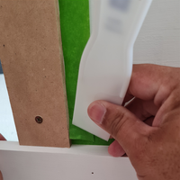 Step 3.2 Push second strip corner tape down with scraper.png Step 3.2 Push second strip corner tape down with scraper.png