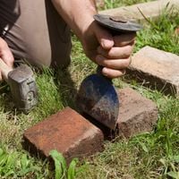 8. Cut bricks with a bolster and lump hammer.jpg 8. Cut bricks with a bolster and lump hammer.jpg