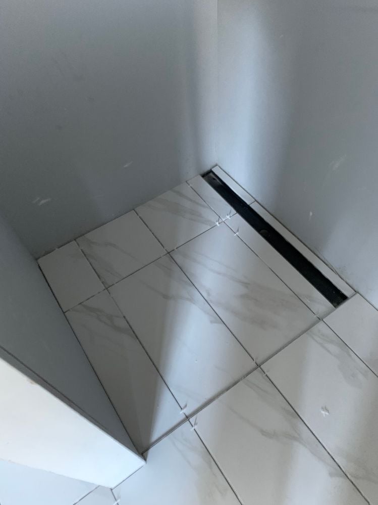 Tiling shower.JPG Tiling shower.JPG