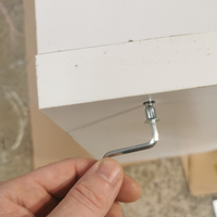 1.3 Tightening fixings of storage unit.png 1.3 Tightening fixings of storage unit.png