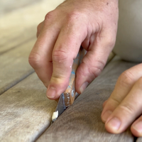 5. Remove debris from between the boards.png 5. Remove debris from between the boards.png