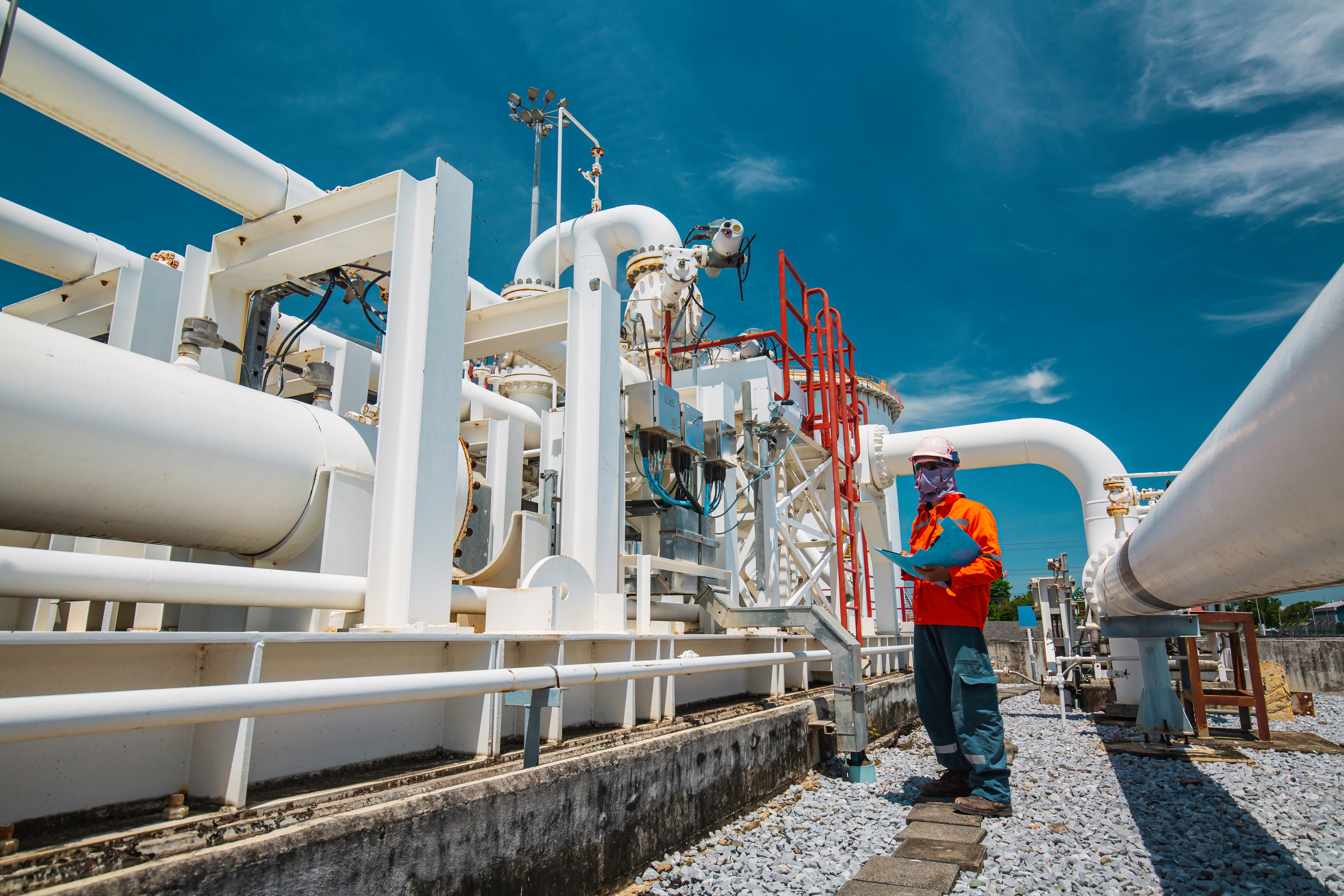 Gas pipelines with man in hard hat.jpg Gas pipelines with man in hard hat.jpg