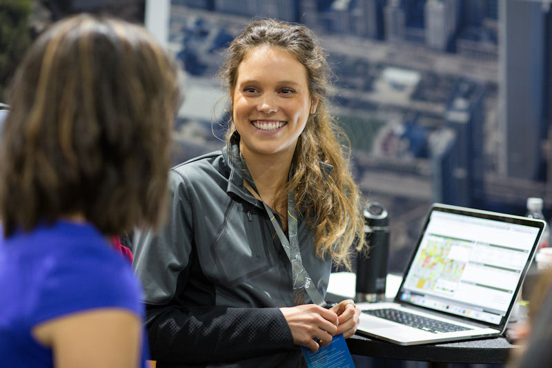 Woman with laptop showing GIS technology