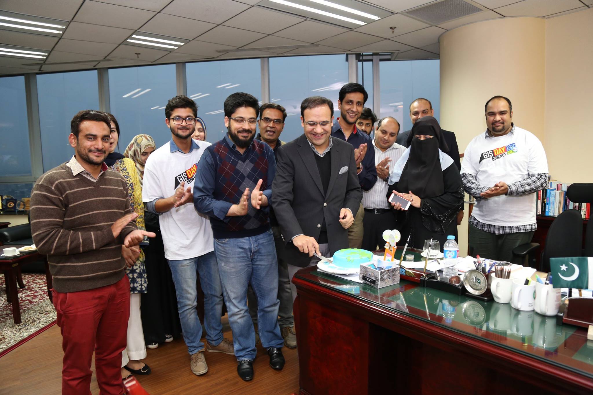 Cutting the GIS Day Cake in Pakistan.