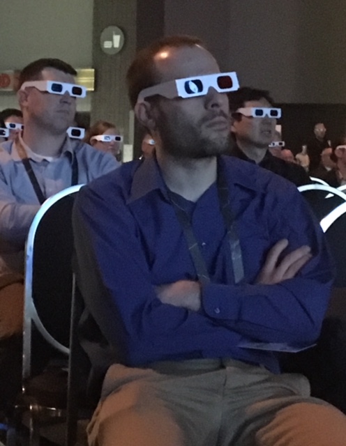 Crowd looking at maps in 3D vision